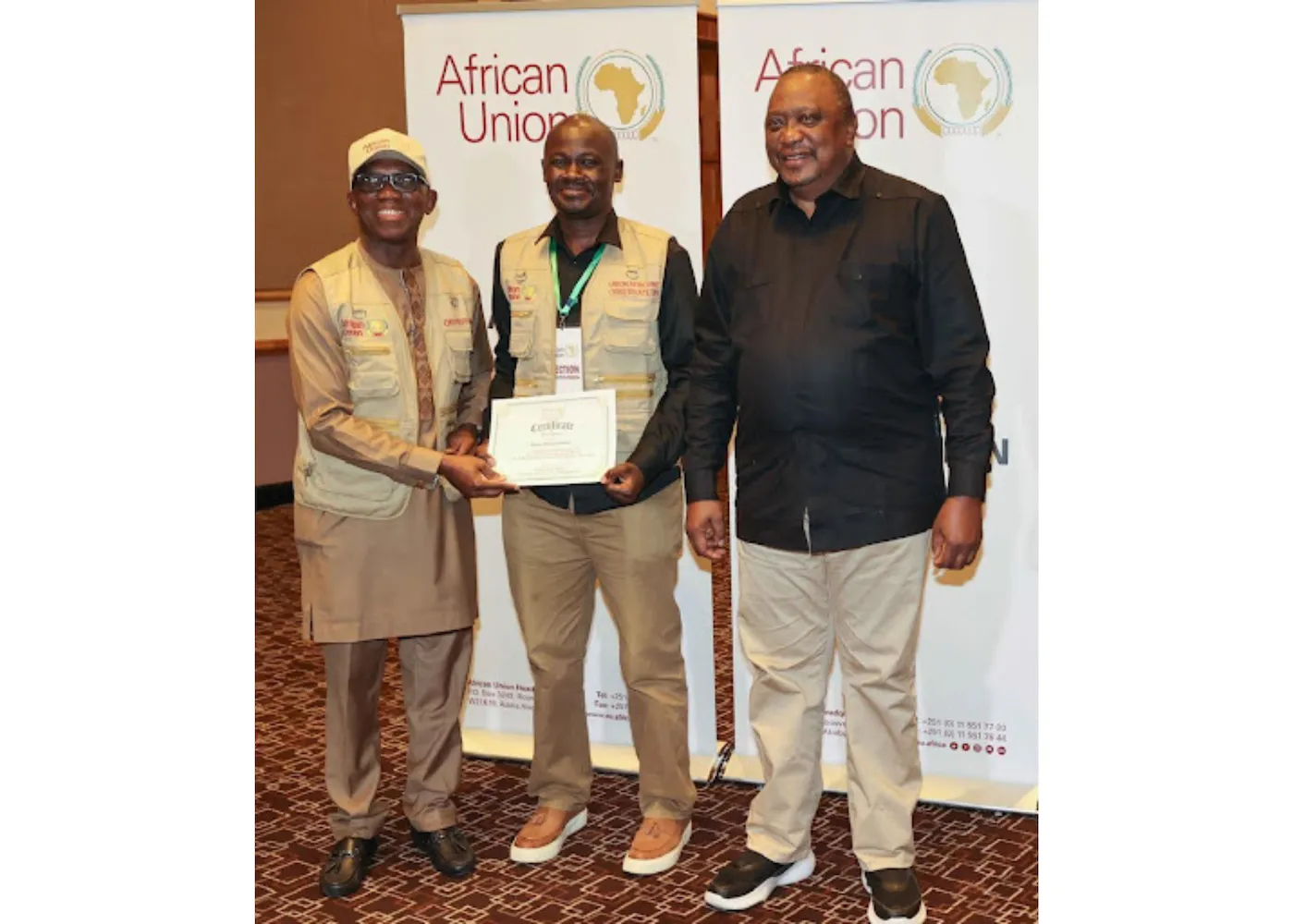 Absolom Shalakha (center) receiving award