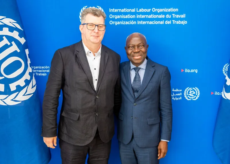 Siarhei Antusevich poses with Gilbert F. Houngbo