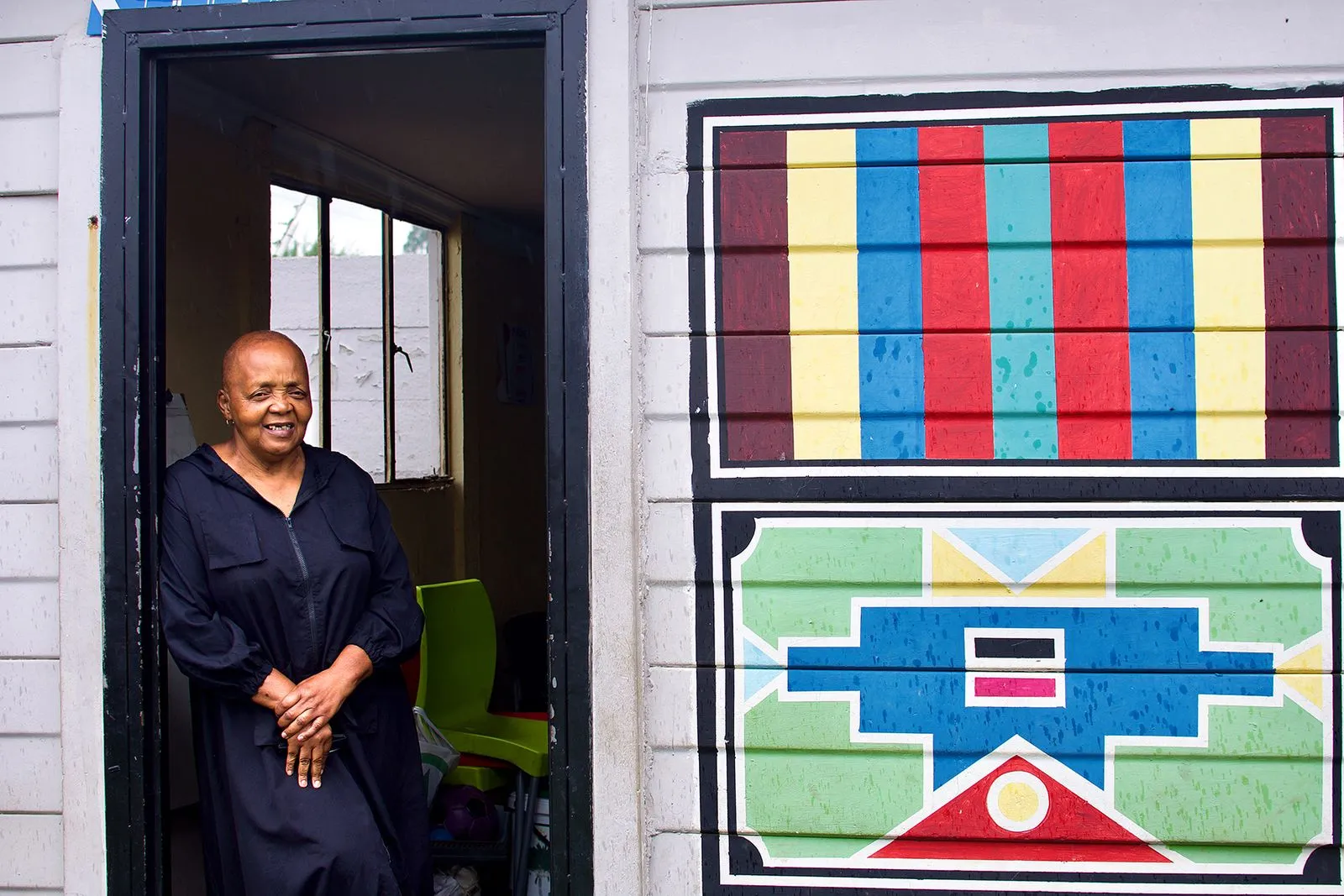 Carol Dyantyi at the entrance of the Uzima kids centre in Ezimbuzini, Soweto, where she has dedicated her life to supporting vulnerable children. 